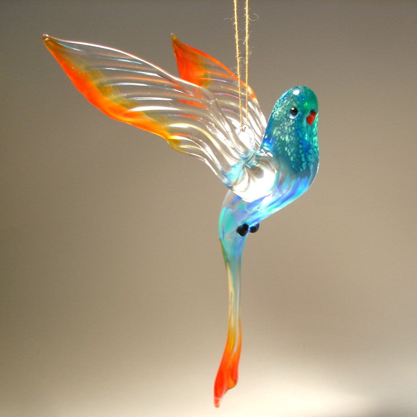 Glass parrot ornament in blue, clear and red