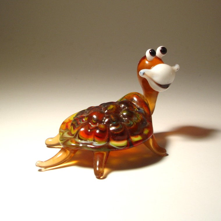 Back side of the turtle figurine focused on its intricate shell design.