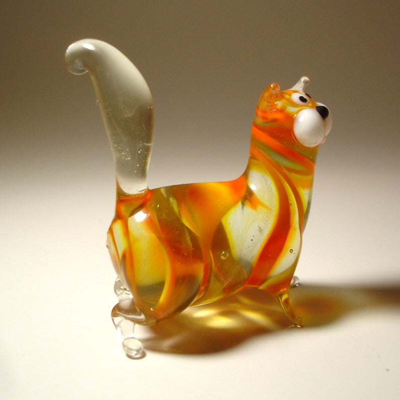 Aback view of the glass cat showing its short clear glass legs and upright clear ears.
