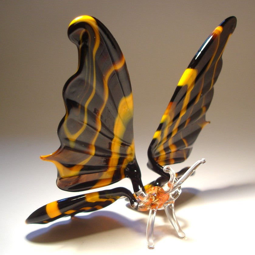Back view of the dramatic black and orange butterfly figurine