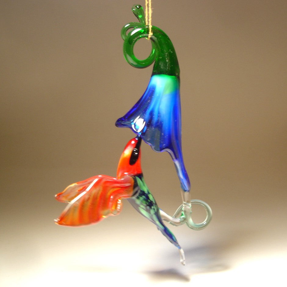 Handmade glass hummingbird figurine and blue flower ornament
