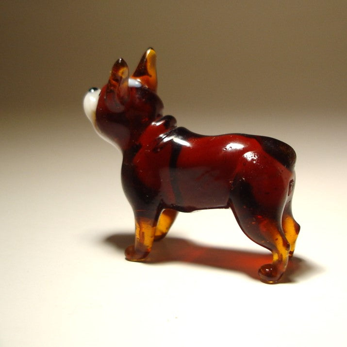 Close-up of the glass Boston Terrier figurine's back, highlighting its charming expression and glossy brown and white markings.