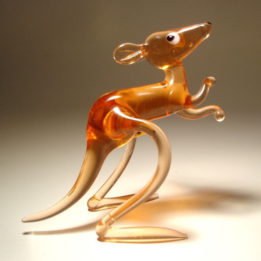A beautifully crafted glass figurine of a kangaroo with a baby joey in her pouch, standing upright with lifelike posture.