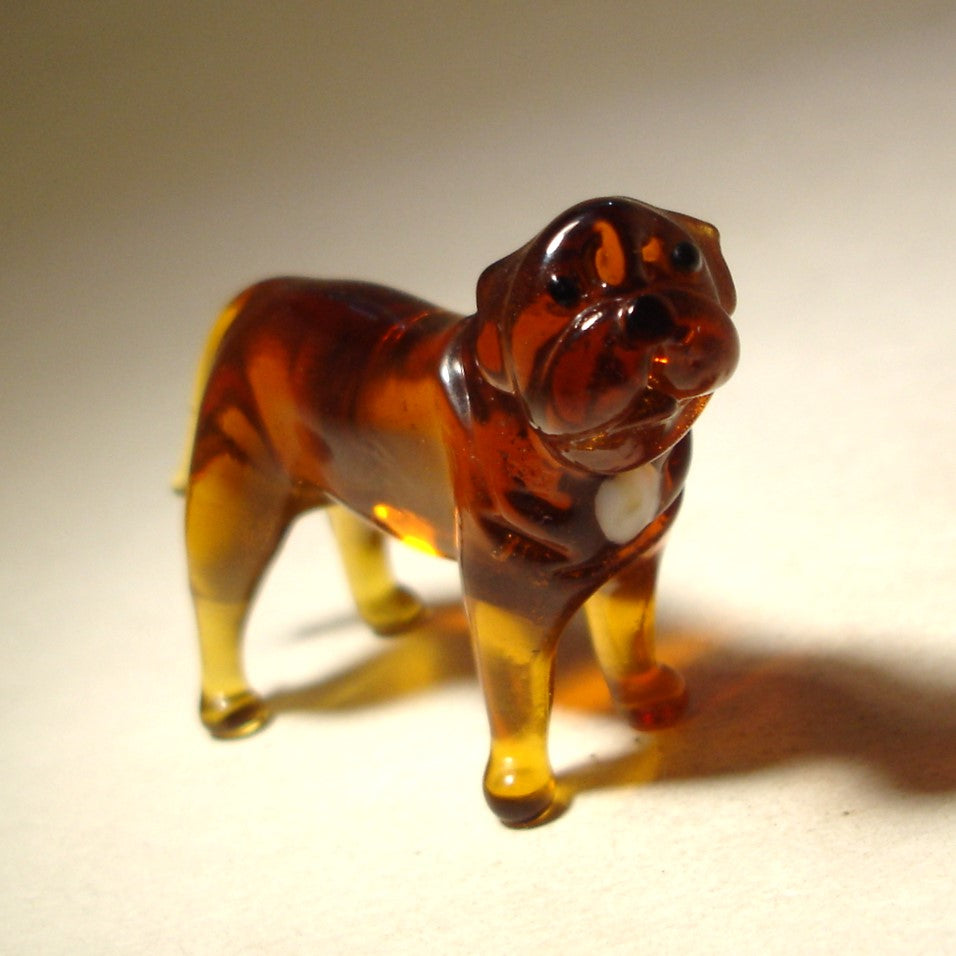 A close-up shot of the glass Mastiff figurine, focusing on the intricate details of its face and expressive eyes.