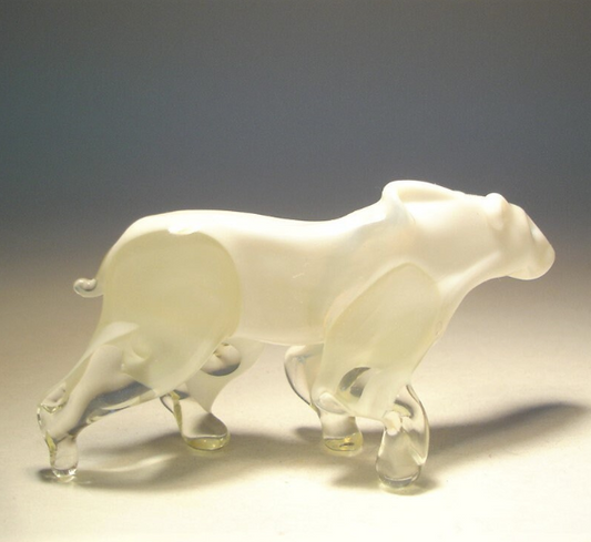 Side angle of the glass polar bear figurine, depicting the bear in a walking pose.