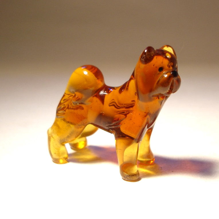 Handcrafted glass Chow Chow figurine in a standing position, showcasing the breed’s thick fur and lion-like mane.