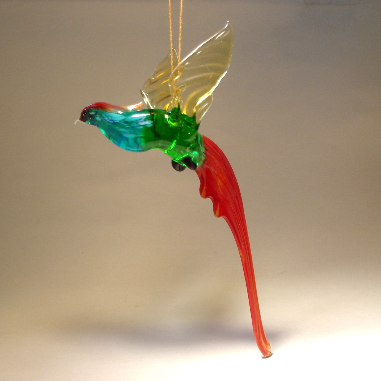 The glass Hanging Bird Pheasant figurine ornament viewed from a different angle, displaying its distinctive long tail and graceful posture.