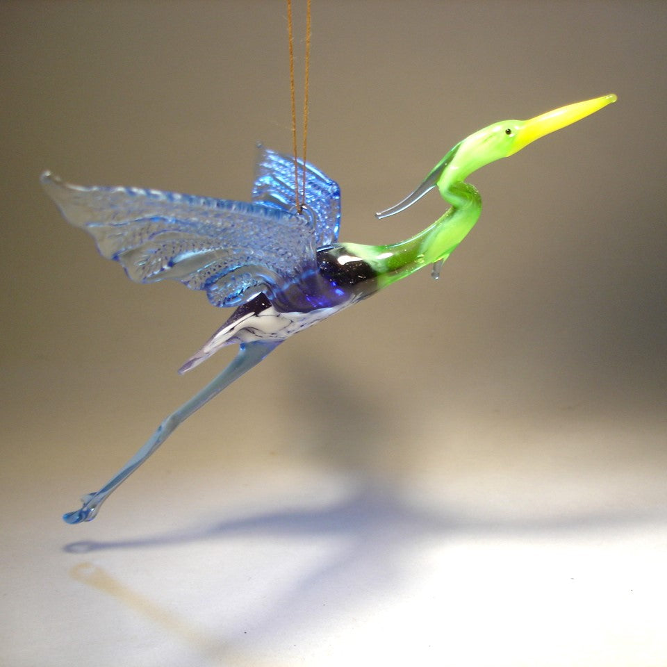 Close-up of the Glass Heron in Flight Hanging Figurine Ornament, capturing the heron's outstretched wings and detailed feathers as it soars.