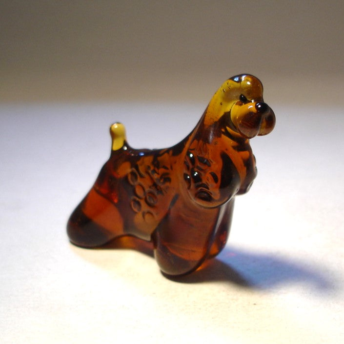 Close-up of the glass Cocker Spaniel figurine’s face, capturing its soft expression and finely detailed ears.