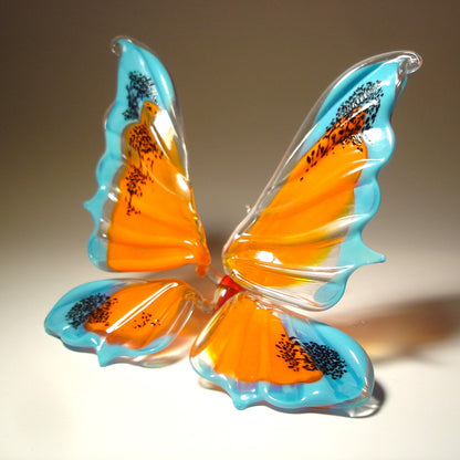 Handmade glass blue and orange figurine - side view