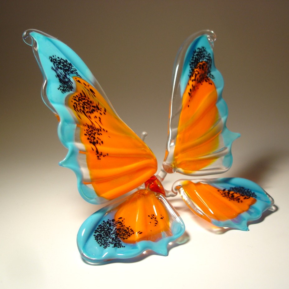 Blue and Orange Glass Butterfly figurine with black specs on it's wings' tips