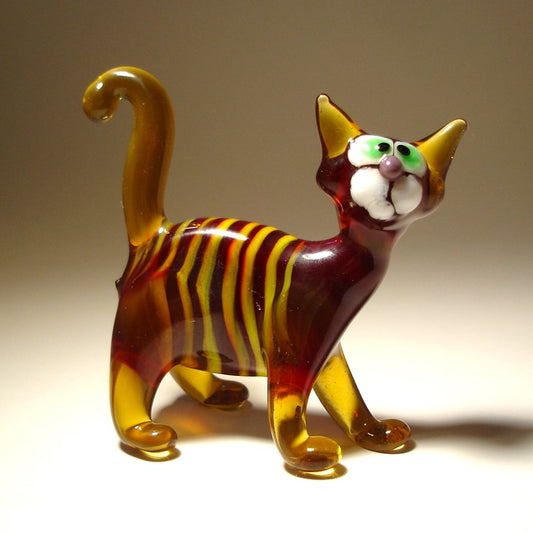 Glass brown cat figurine with white stripes,  green eyes and curved tail