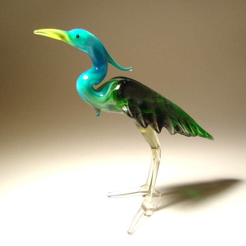 Front view of a glass blue neck heron figurine, showcasing its elegant stance and long, graceful neck.
