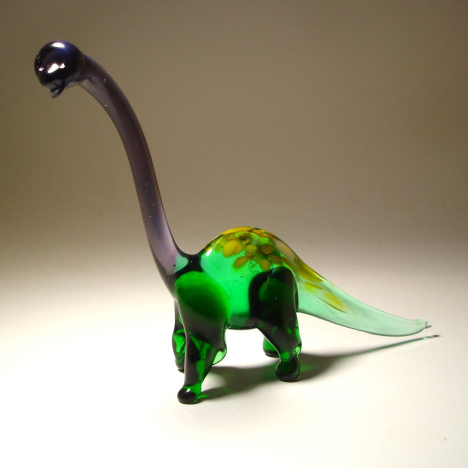 Front view of a glass Brachiosaurus figurine, showcasing its long neck and graceful stance.