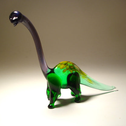 Front view of a glass Brachiosaurus figurine, showcasing its long neck and graceful stance.