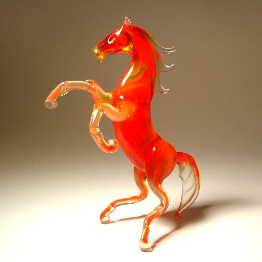 Handcrafted red glass horse figurine rearing