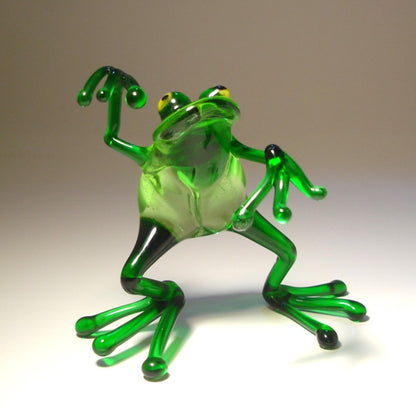 Front view of the glass dancing frog figurine, emphasizing the happy lively posture.