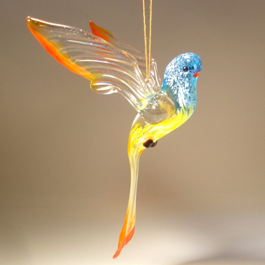 Glass parrot ornament in blue, yellow and red