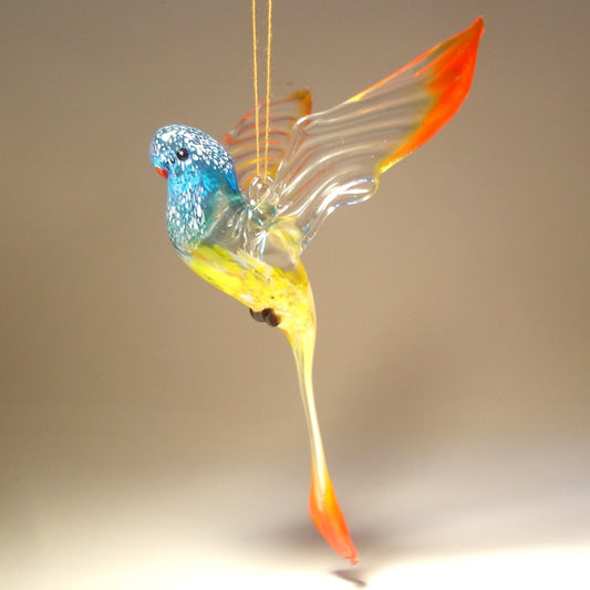 A colorful glass handmade Blue, Yellow & Red Parrot Parakeet ornament.