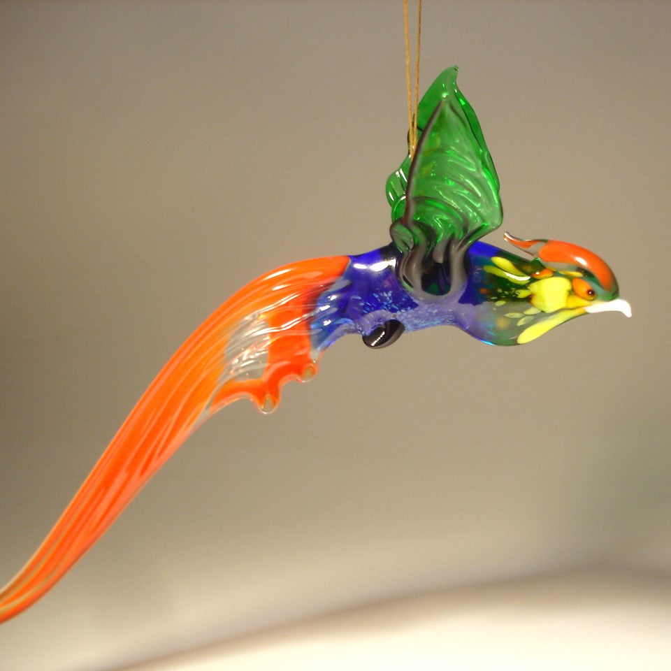 A glass Hanging Bird Pheasant figurine ornament with orange, yellow and green plumage. 