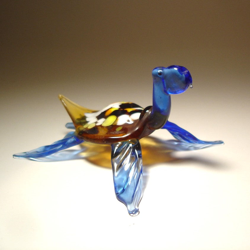 Handmade blue glass turtle figurine with colorful shell