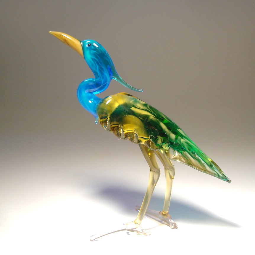 Handmade glass blue neck heron figurine with  intricate details of its feathers and poised posture.
