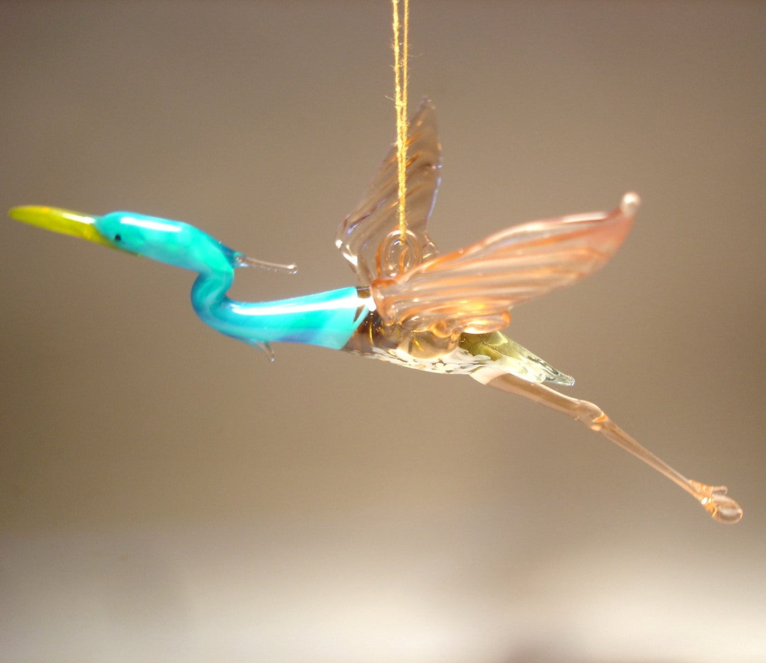 Close-up of the Glass Heron in Flight Hanging Figurine Ornament, capturing the heron's outstretched wings and detailed feathers as it soars.