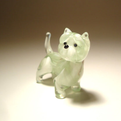 The glass West Highland Terrier figurine is displayed from a side angle, emphasizing the terrier’s strong stance, short legs, and curved up tail.
