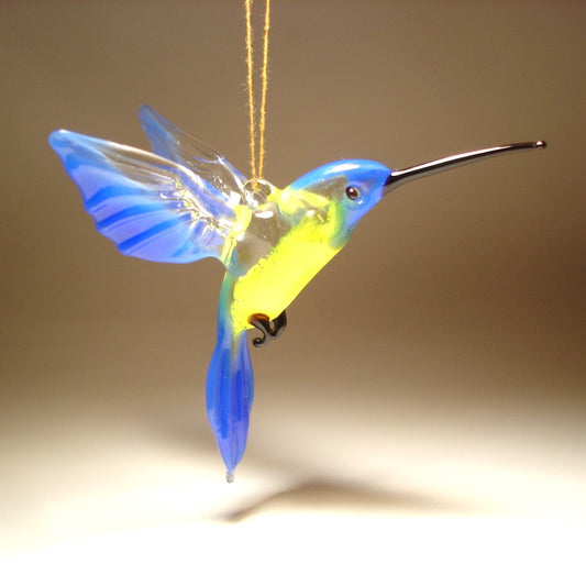 blue and yellow glass hanging hummingbird ornament, suspended from the string 