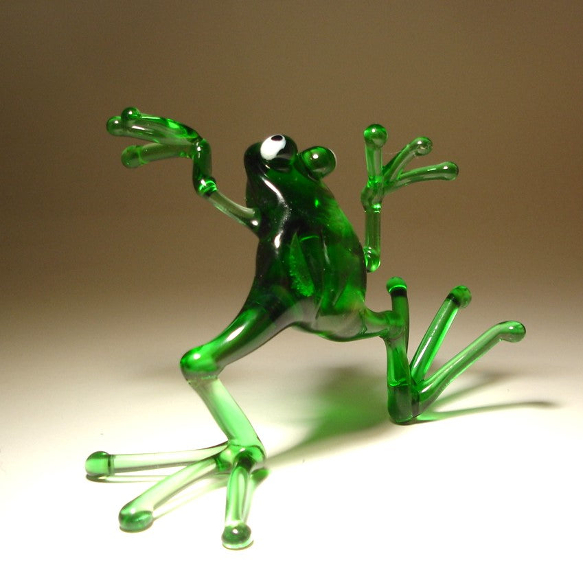 Back view of the glass dancing frog figurine, highlighting the frog's playful posture and vibrant green color.