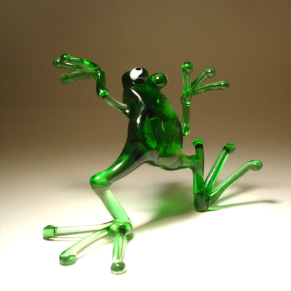Back view of the glass dancing frog figurine, highlighting the frog's playful posture and vibrant green color.
