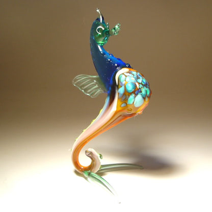 Front view of the glass blue seahorse figurine, focusing on the craftsmanship of its head, spiraled tail, and fine detailing on the fins.