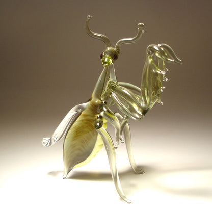 Handmade glass mantis figurine in light gray-green color with yellow belly