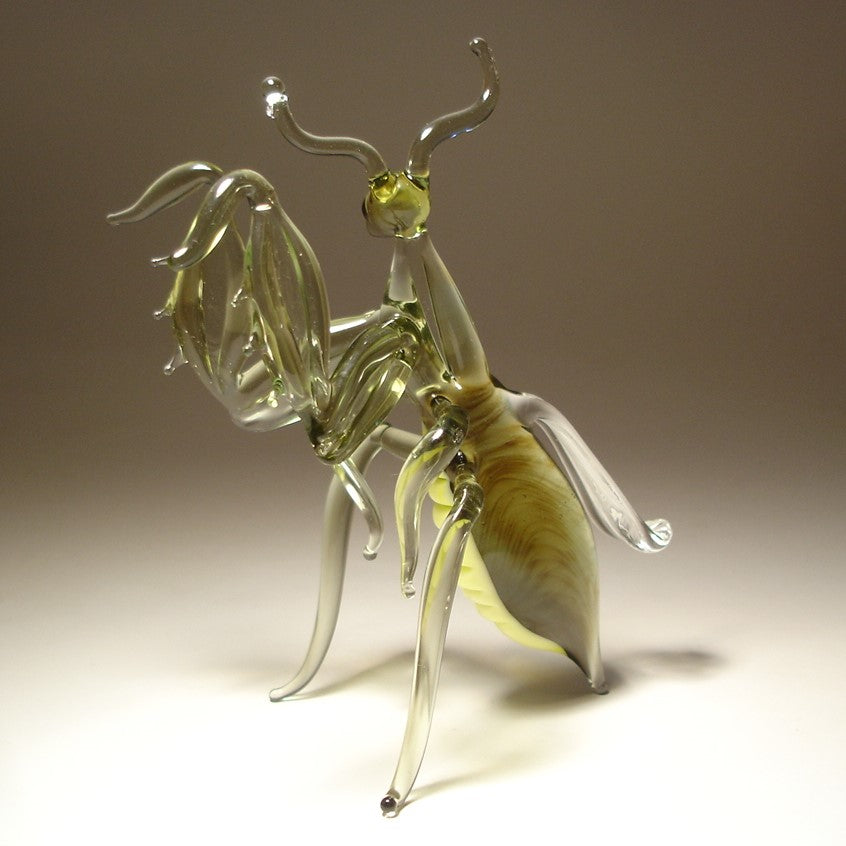 The other view of the glass mantis figurine showing intricate front legs.
