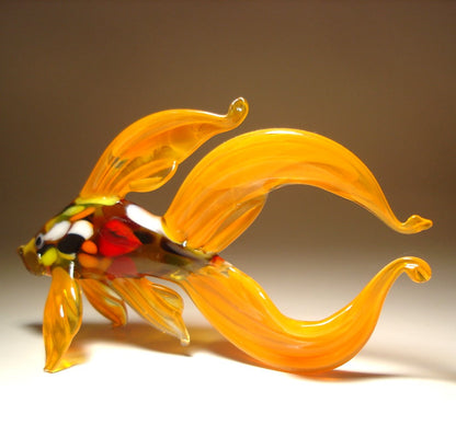 Another view of the orange Betta fish glass figurine, showing the elegant curvature of the fish’s body and the wide double tail.