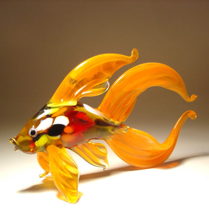 Handmade glass Orange Betta fish with  multicolored specs n its body.