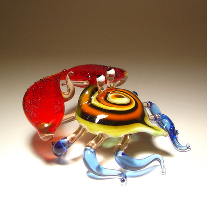 Handmade glass crab sculpture wit a swirled shell and blue legs