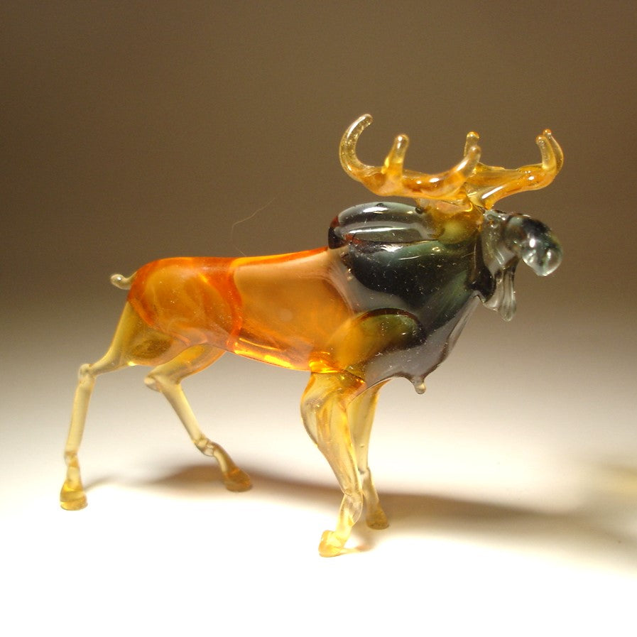 Side view of the glass moose figurine, showcasing its strong stance and elegant curves.
