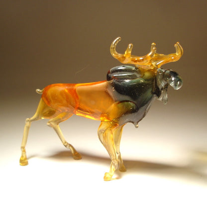 Side view of the glass moose figurine, showcasing its strong stance and elegant curves.