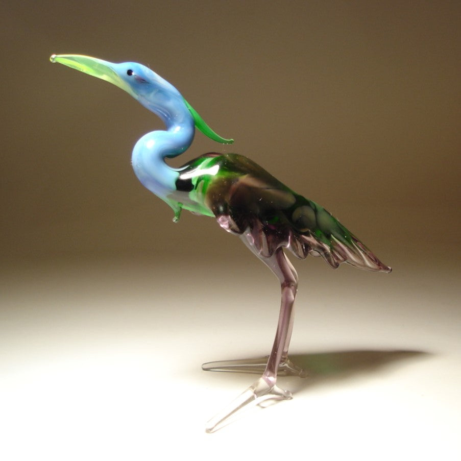 Front view of a glass blue neck heron figurine, showcasing its elegant stance and long, graceful neck.