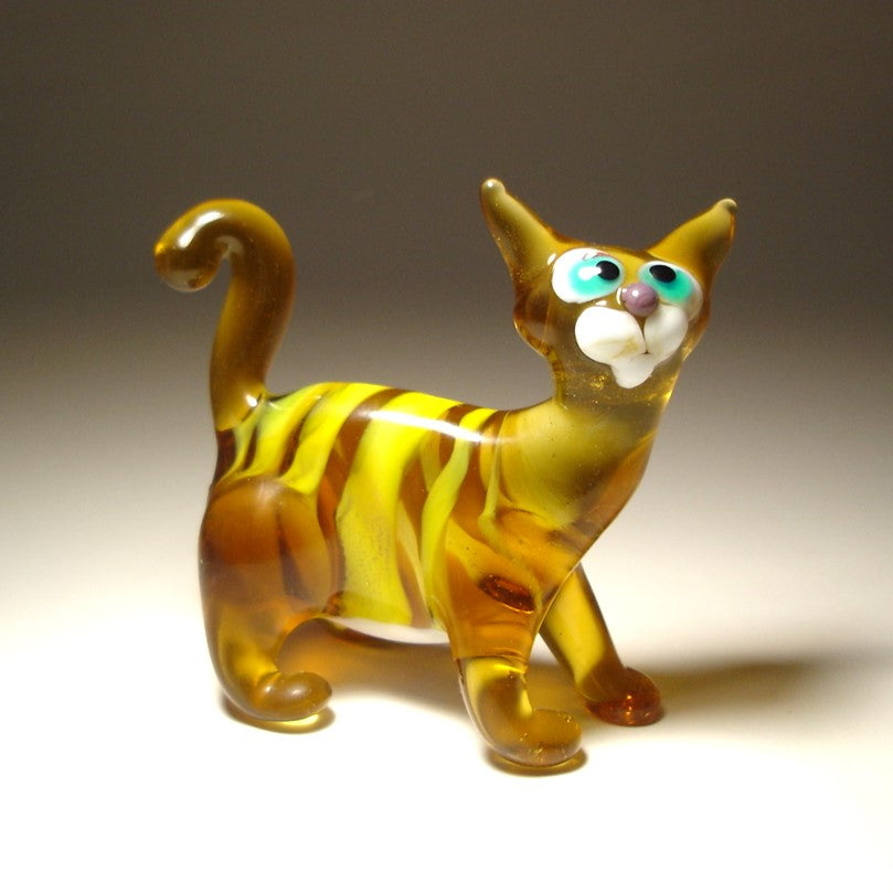 Glass brown cat figurine with yellow stripes,  blue eyes and curved tail