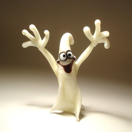 A comical glass white ghost figurine with flowing edges, appearing to float in mid-air.