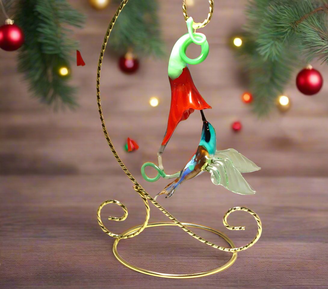 Glass Hummingbird figurine on a stand with festive holiday background