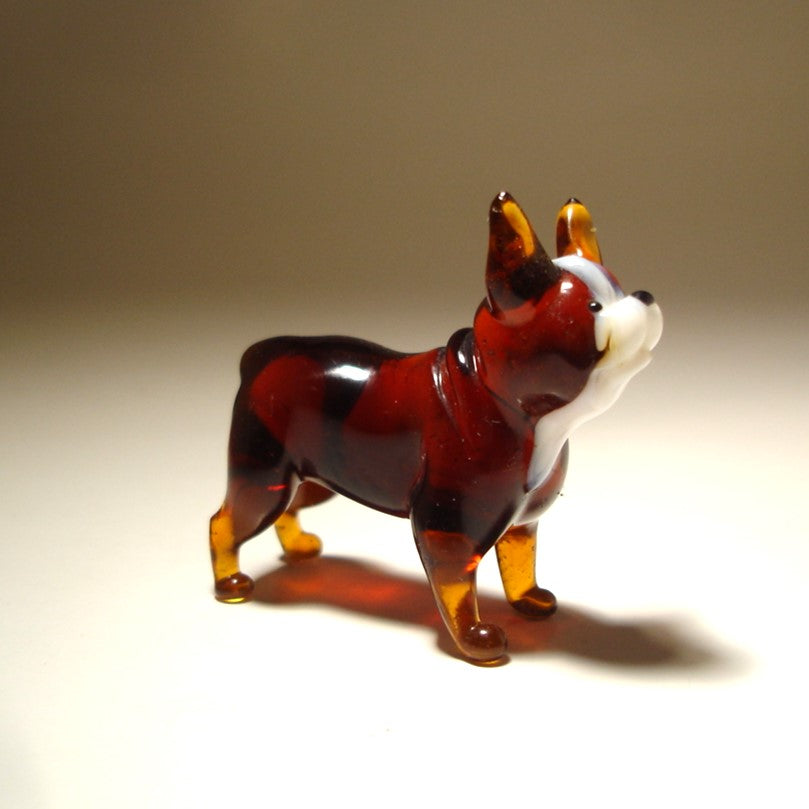 Side view of the glass Boston Terrier figurine, showcasing its compact body and characteristic upright ears.