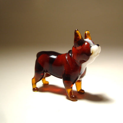 Side view of the glass Boston Terrier figurine, showcasing its compact body and characteristic upright ears.