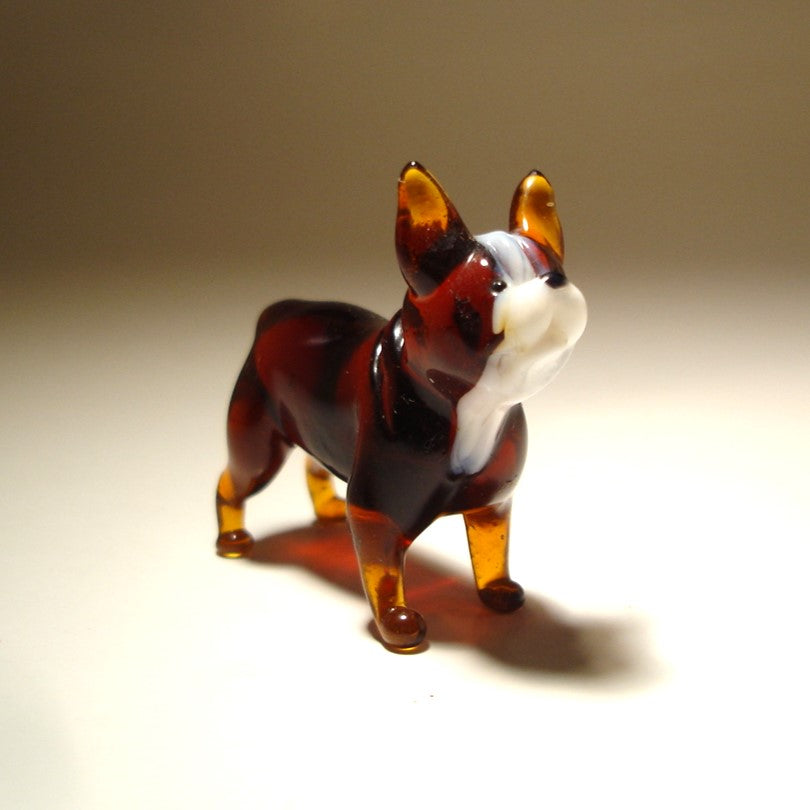 Hadcrafted glass Boston Terrier figurine featuring its distinctive short muzzle and large expressive eyes.