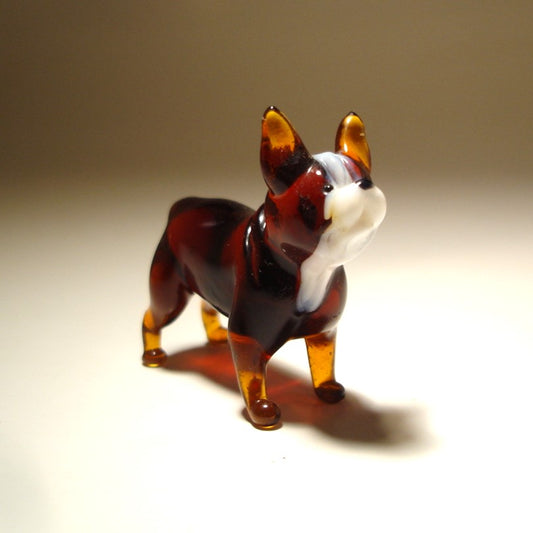 Hadcrafted glass Boston Terrier figurine featuring its distinctive short muzzle and large expressive eyes.