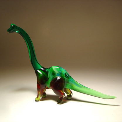 Side view of the glass Brachiosaurus figurine, highlighting its detailed body and towering neck