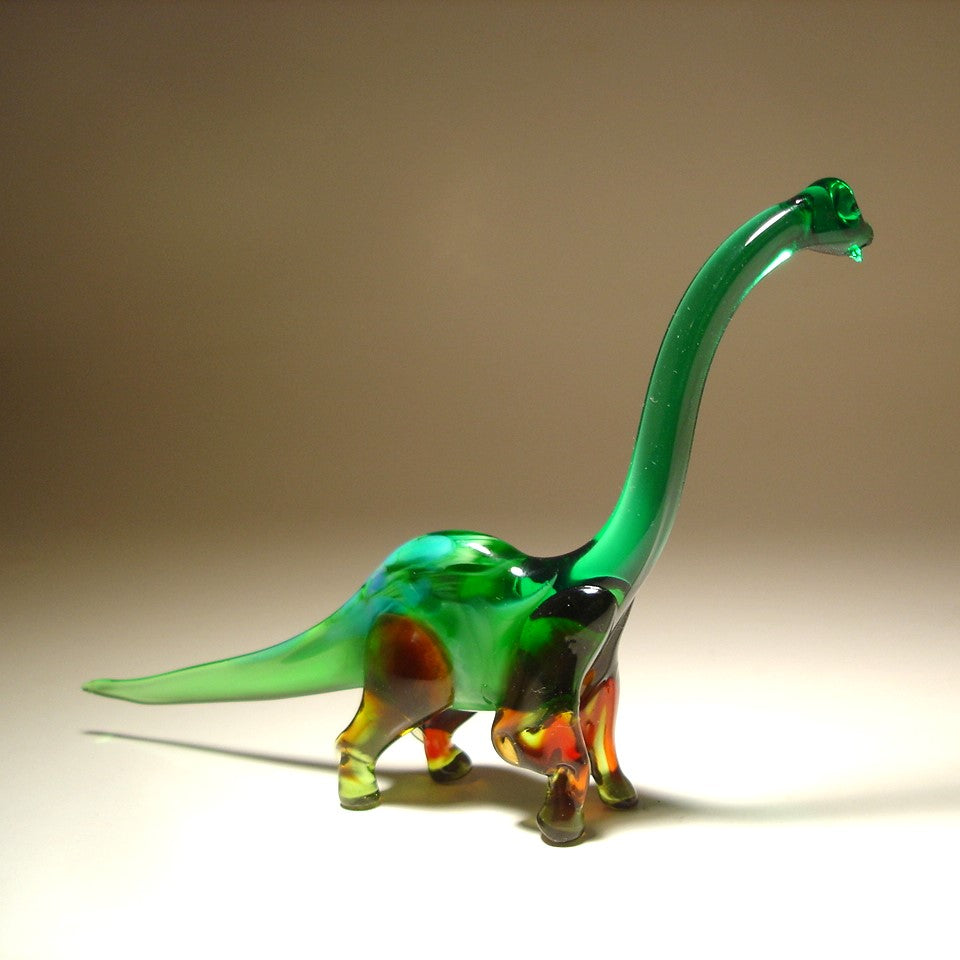 Front view of a glass Brachiosaurus figurine, showcasing its long neck and graceful stance.