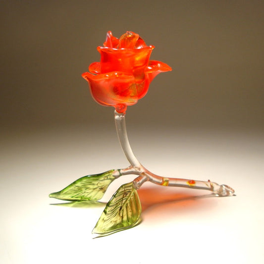 Handcrafted red glass rose figurine  with delicate petals, a curved stem adorned with red glass thorns.